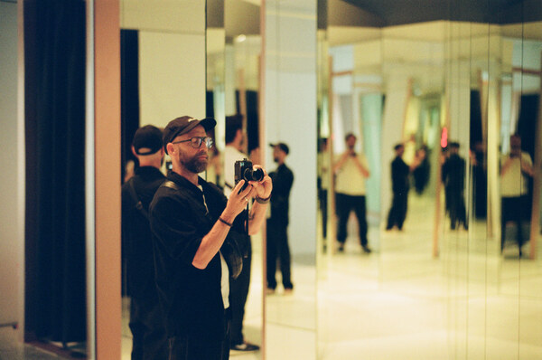 Photographer inside mirrored room