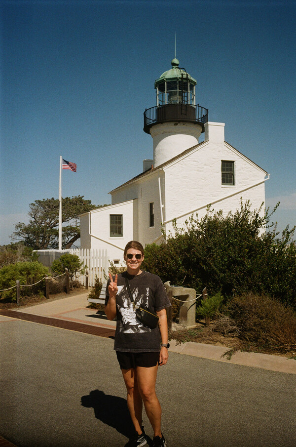 Kelley in front of lighthouse
