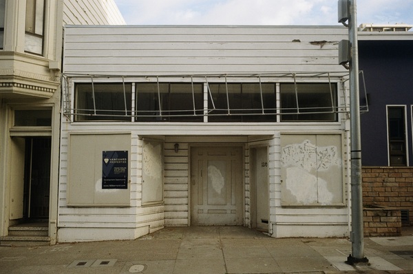 Short white building for sale